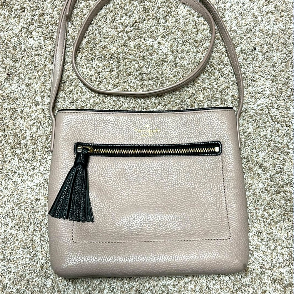 Kate Spade full grain leather Crossbody with black leather accents and tassel